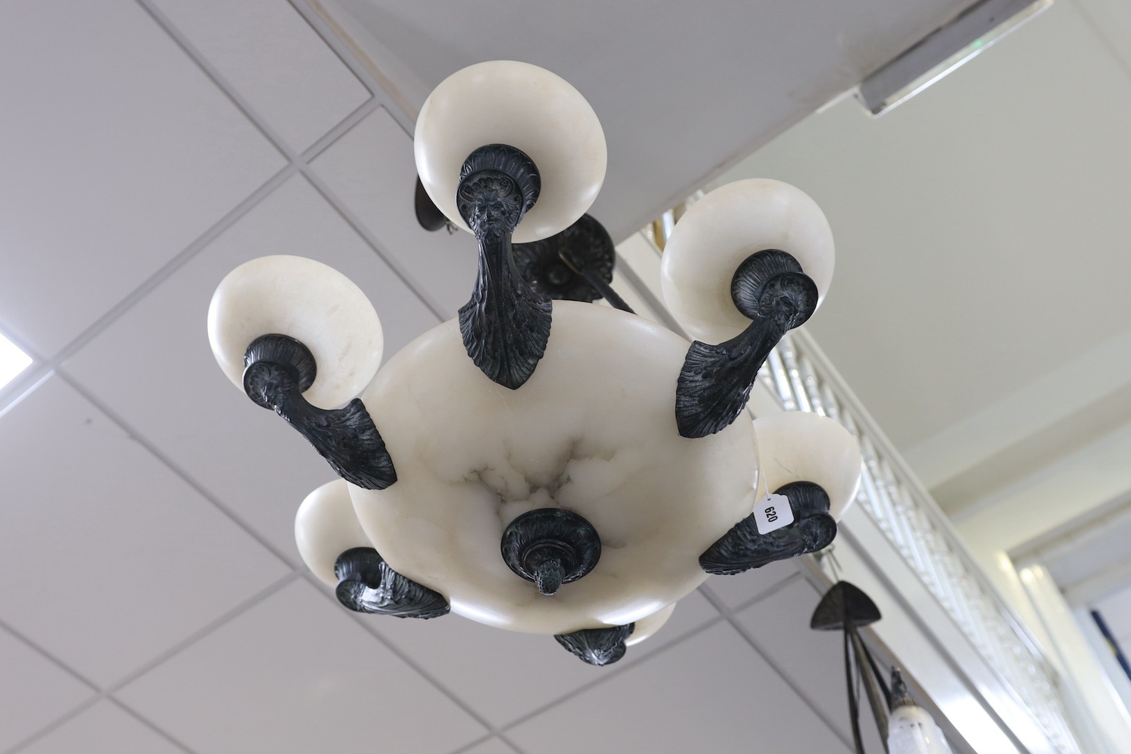 An Empire style bronze and an alabaster chandelier
